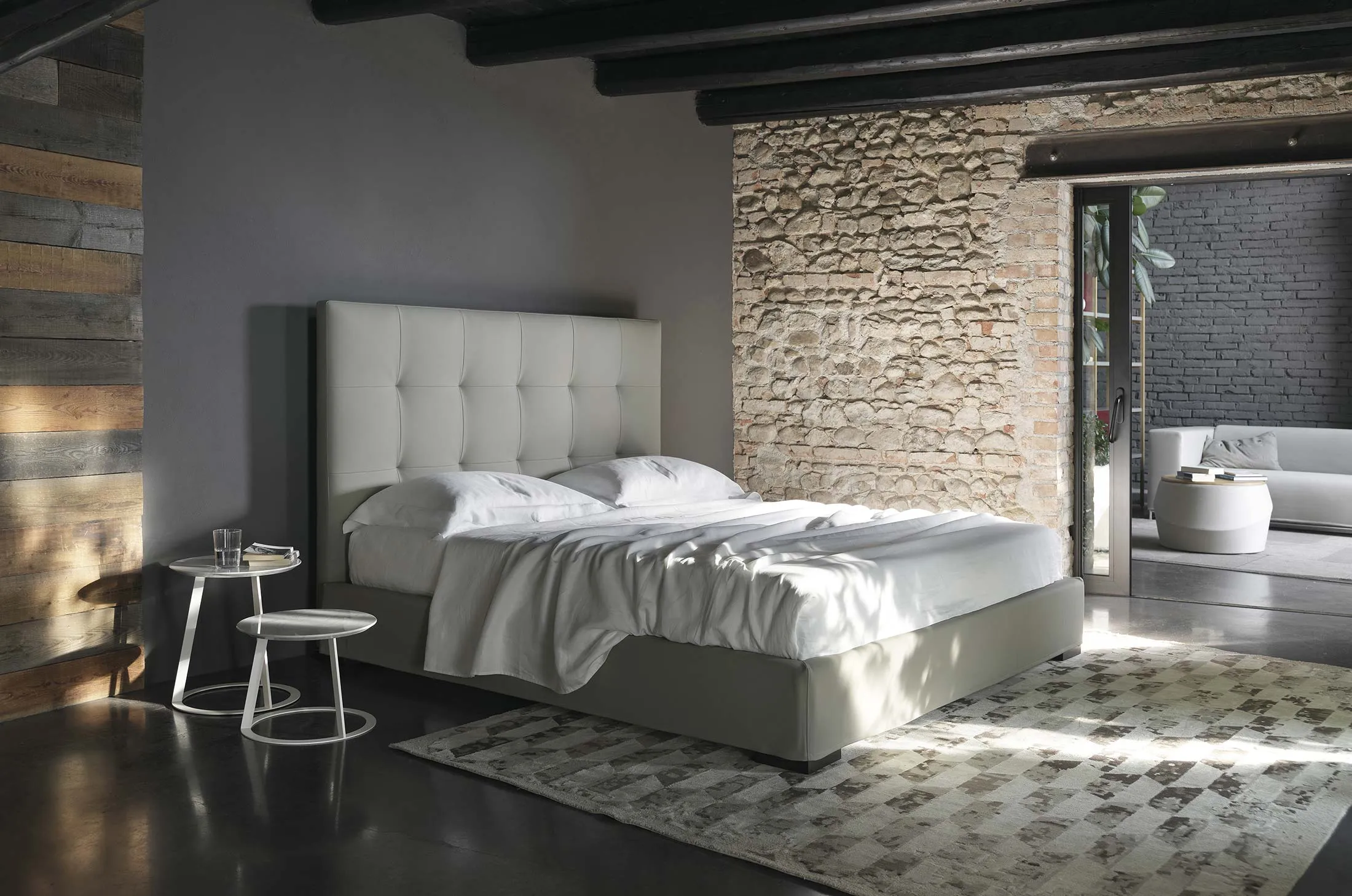 Upholstered leather bed with high headboard